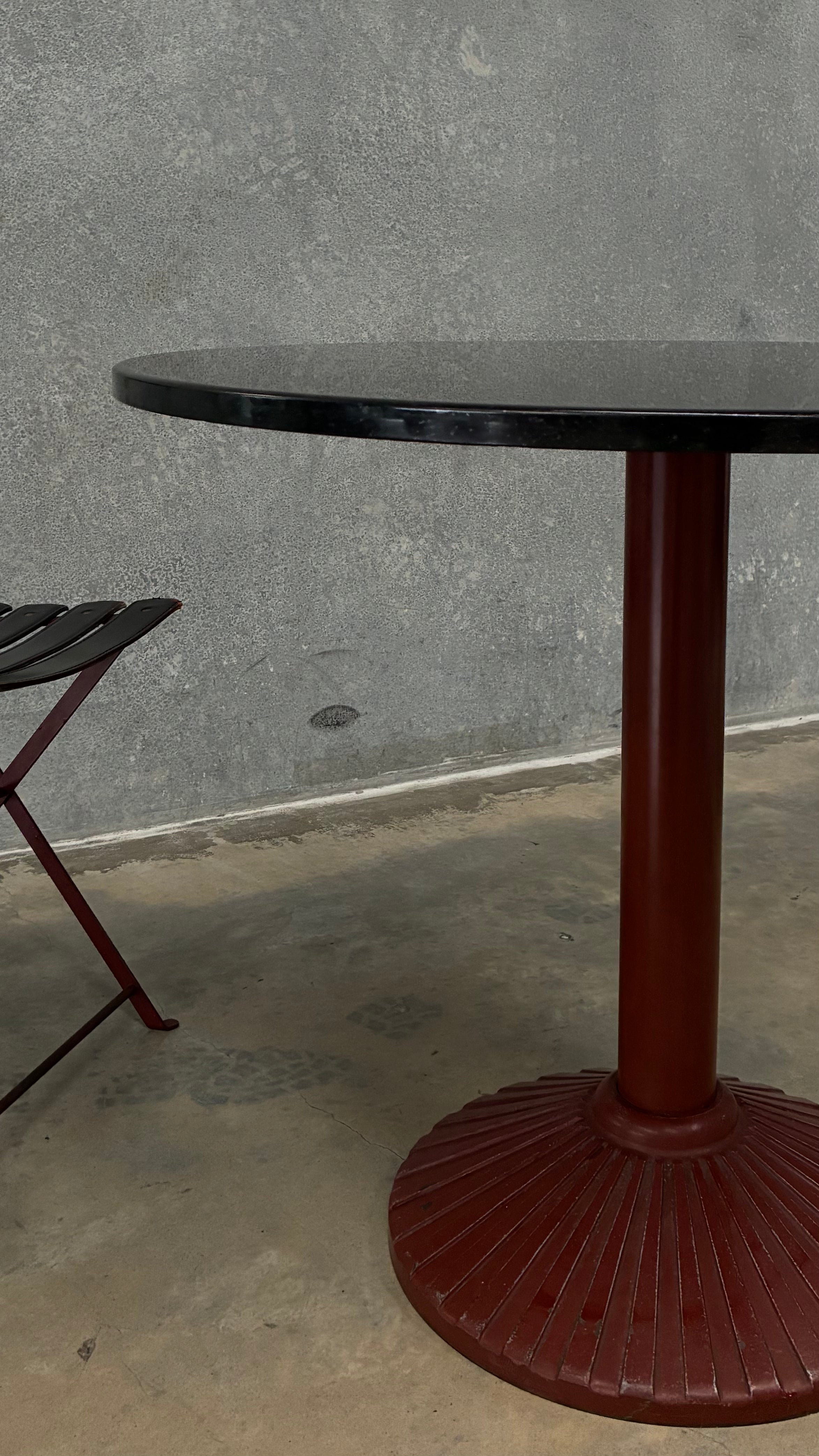 Set of four Zanotta folding chairs, Italy 1980s, presented with a customer grante dining table