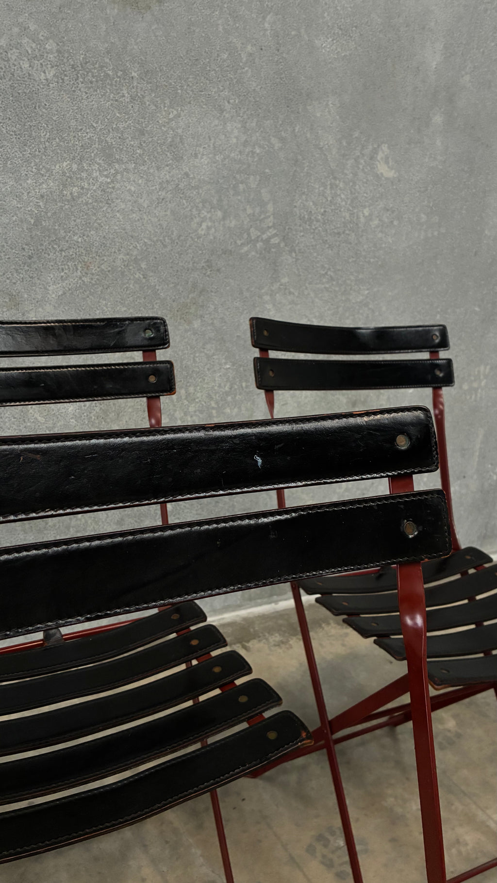 Set of four Zanotta folding chairs, Italy 1980s, presented with a customer grante dining table