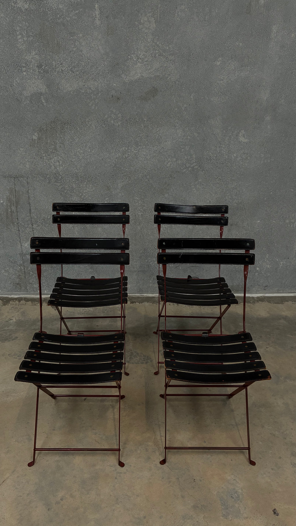Set of four Zanotta folding chairs, Italy 1980s, presented with a customer grante dining table