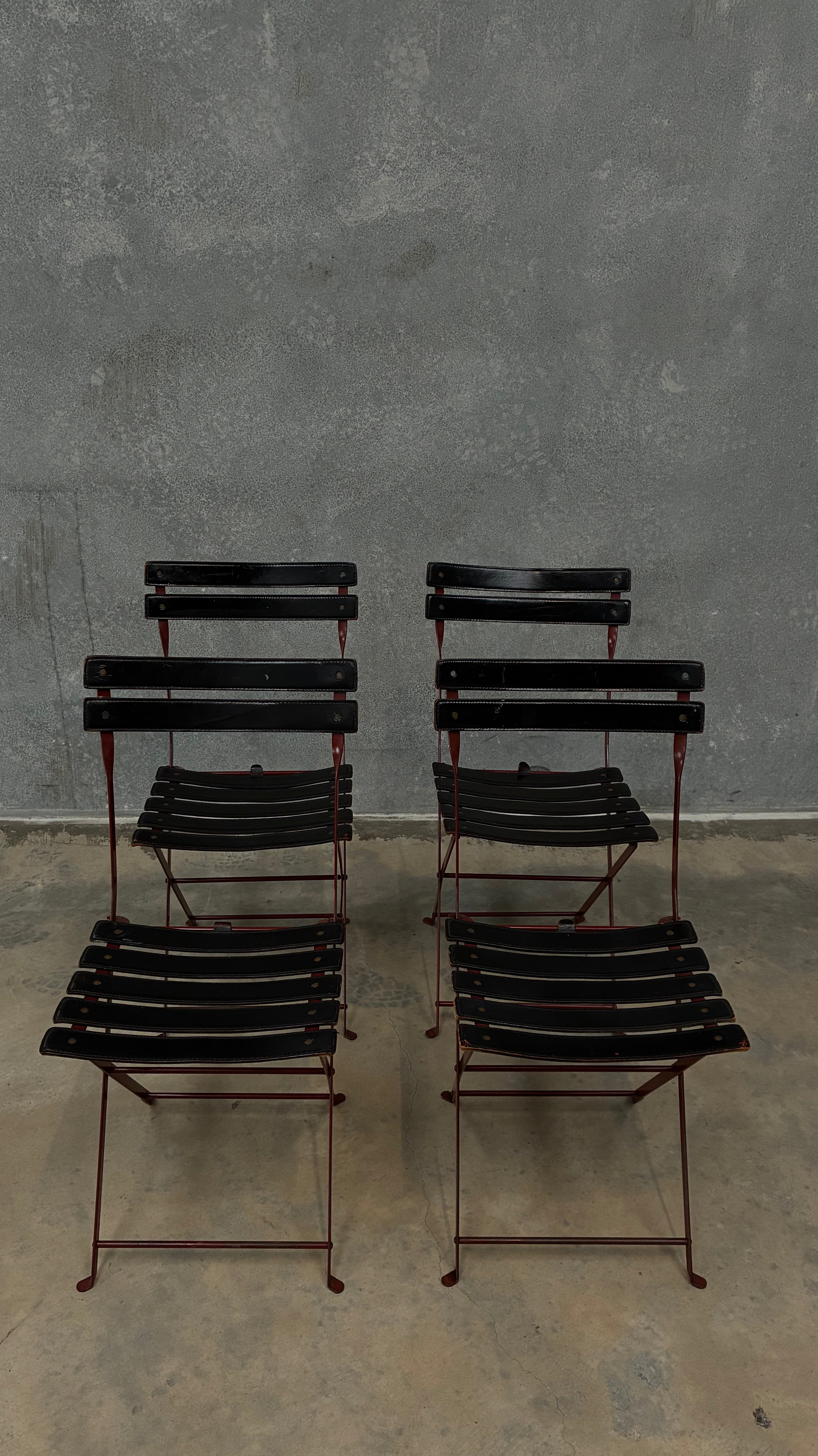 Set of four Zanotta folding chairs, Italy 1980s, presented with a customer grante dining table