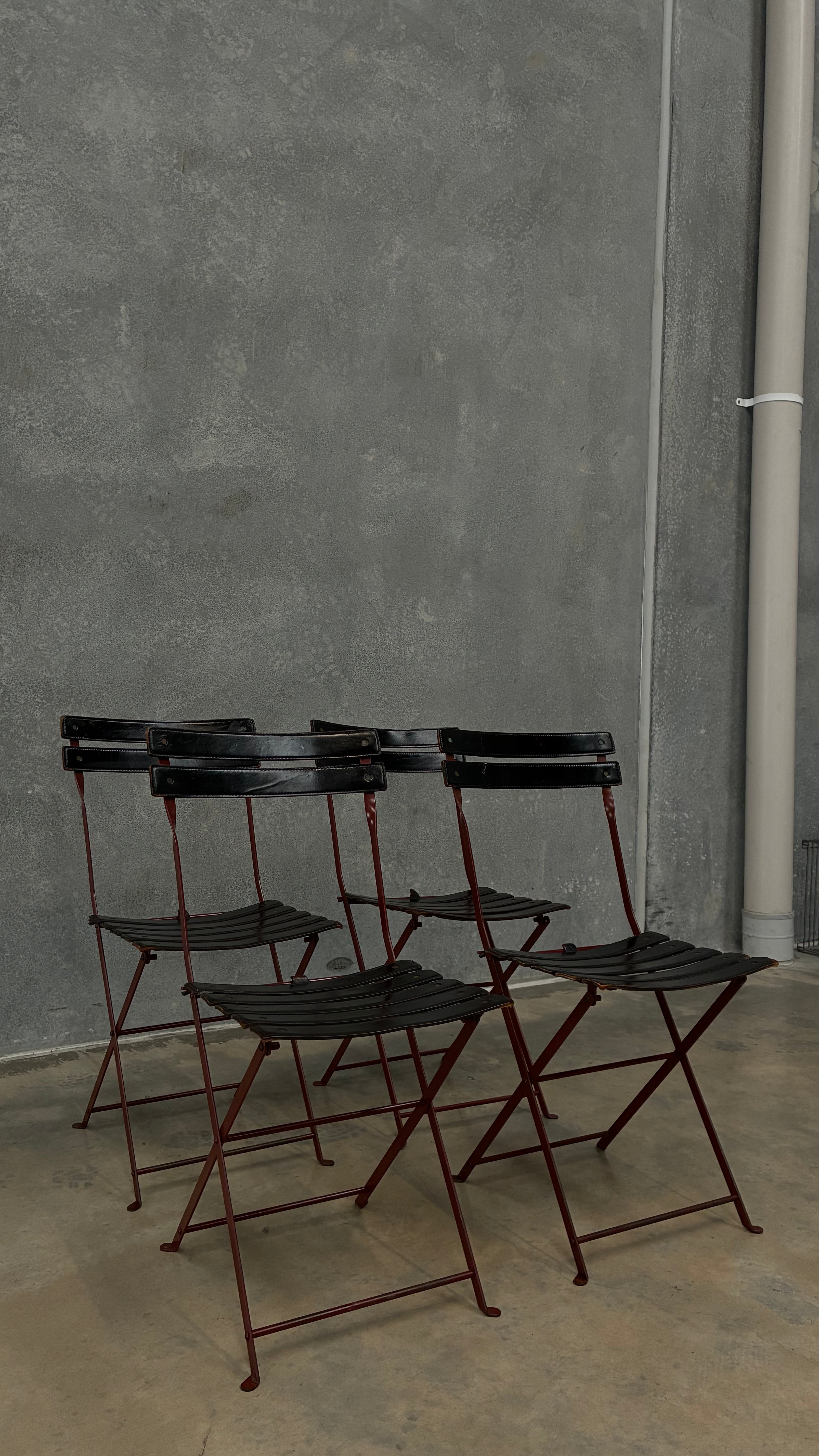 Set of four Zanotta folding chairs, Italy 1980s, presented with a customer grante dining table