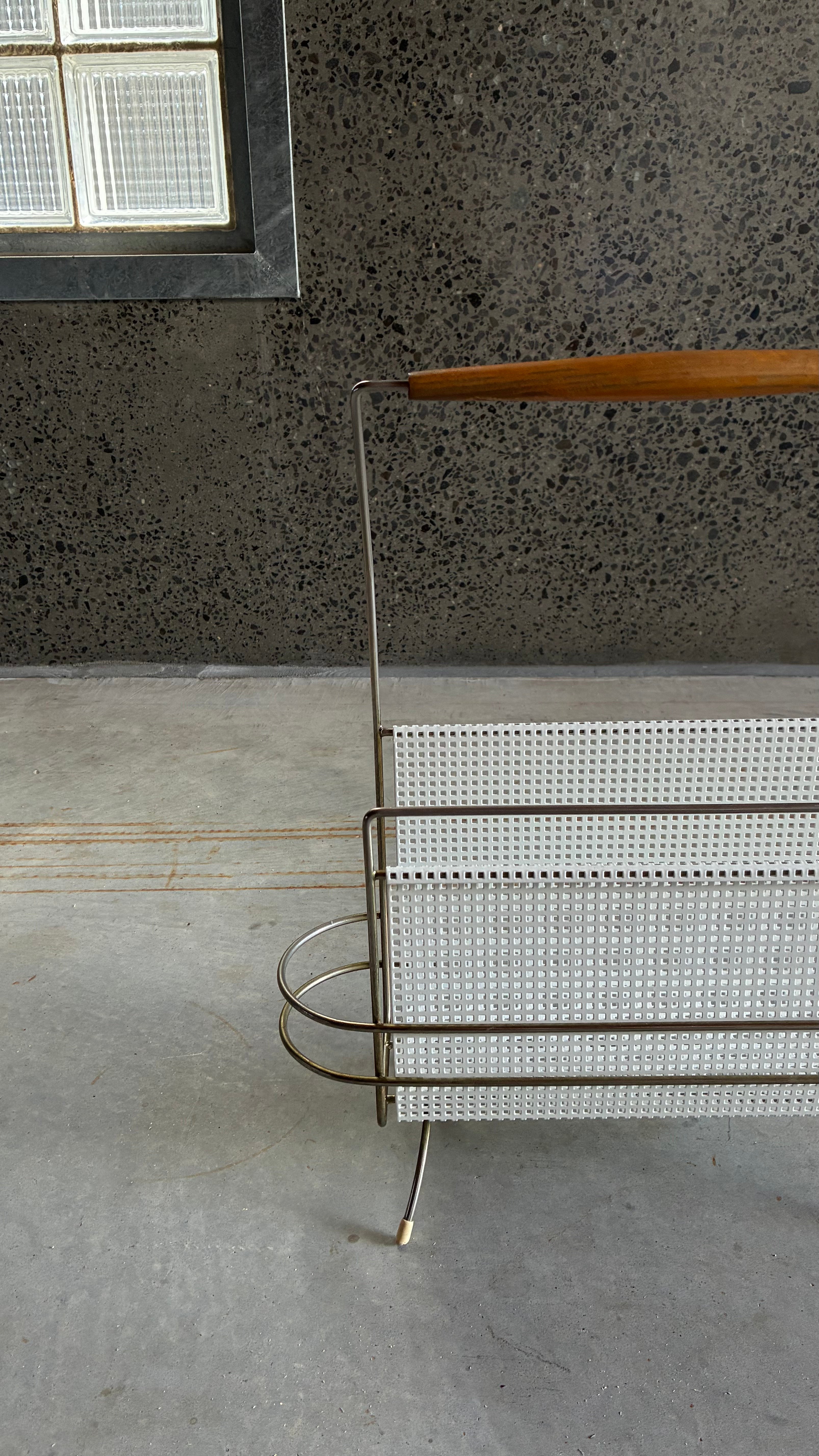 Mid-Century Magazine rack in the style of Mathieu Matégot