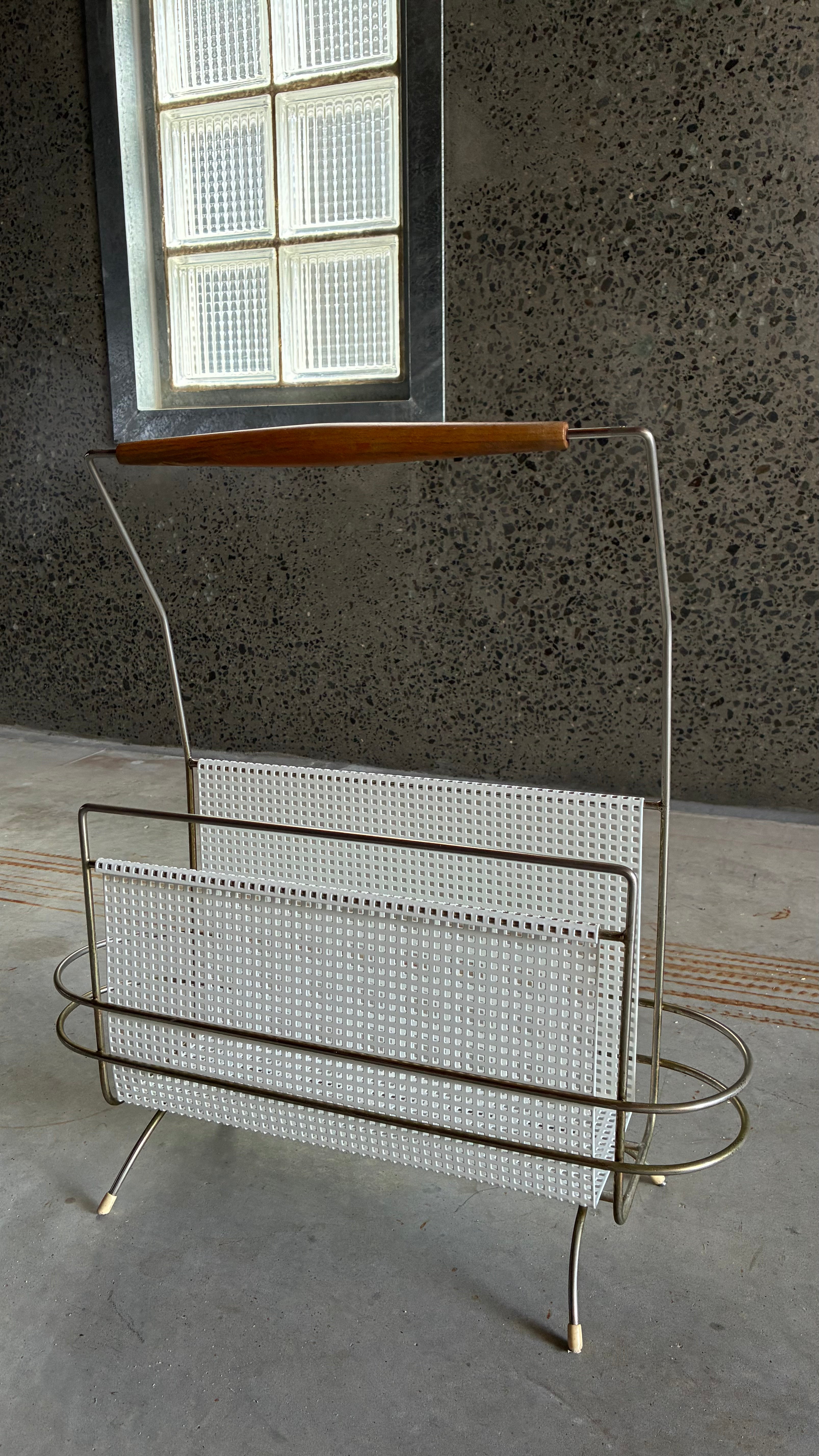 Mid-Century Magazine rack in the style of Mathieu Matégot