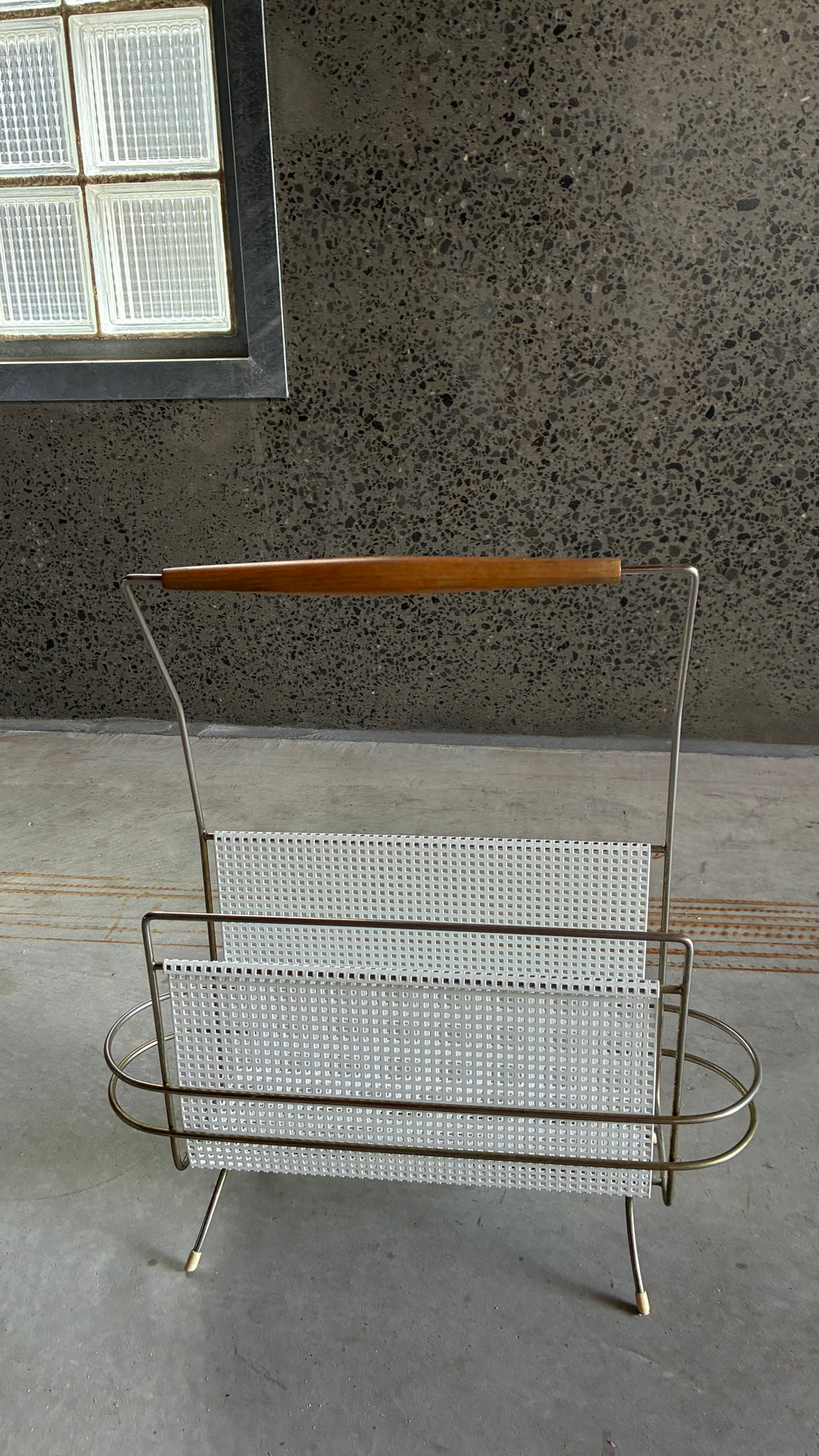 Mid-Century Magazine rack in the style of Mathieu Matégot