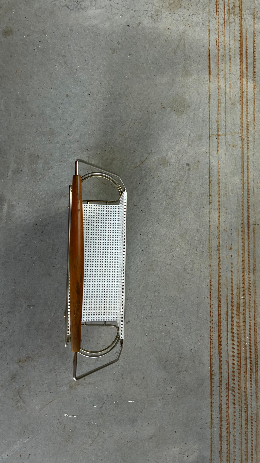 Mid-Century Magazine rack in the style of Mathieu Matégot