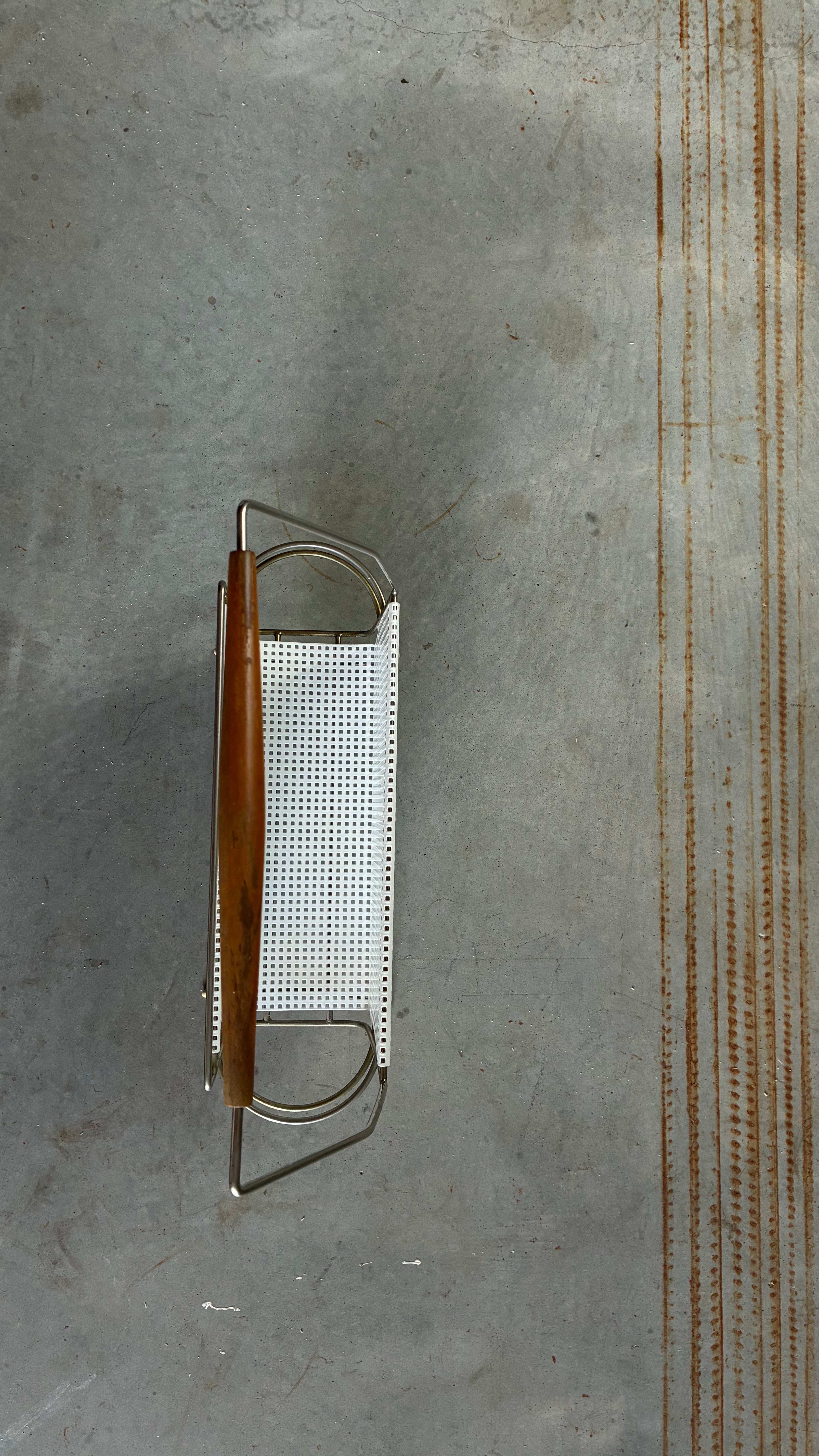 Mid-Century Magazine rack in the style of Mathieu Matégot