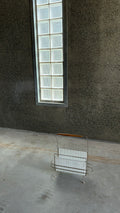 Mid-Century Magazine rack in the style of Mathieu Matégot