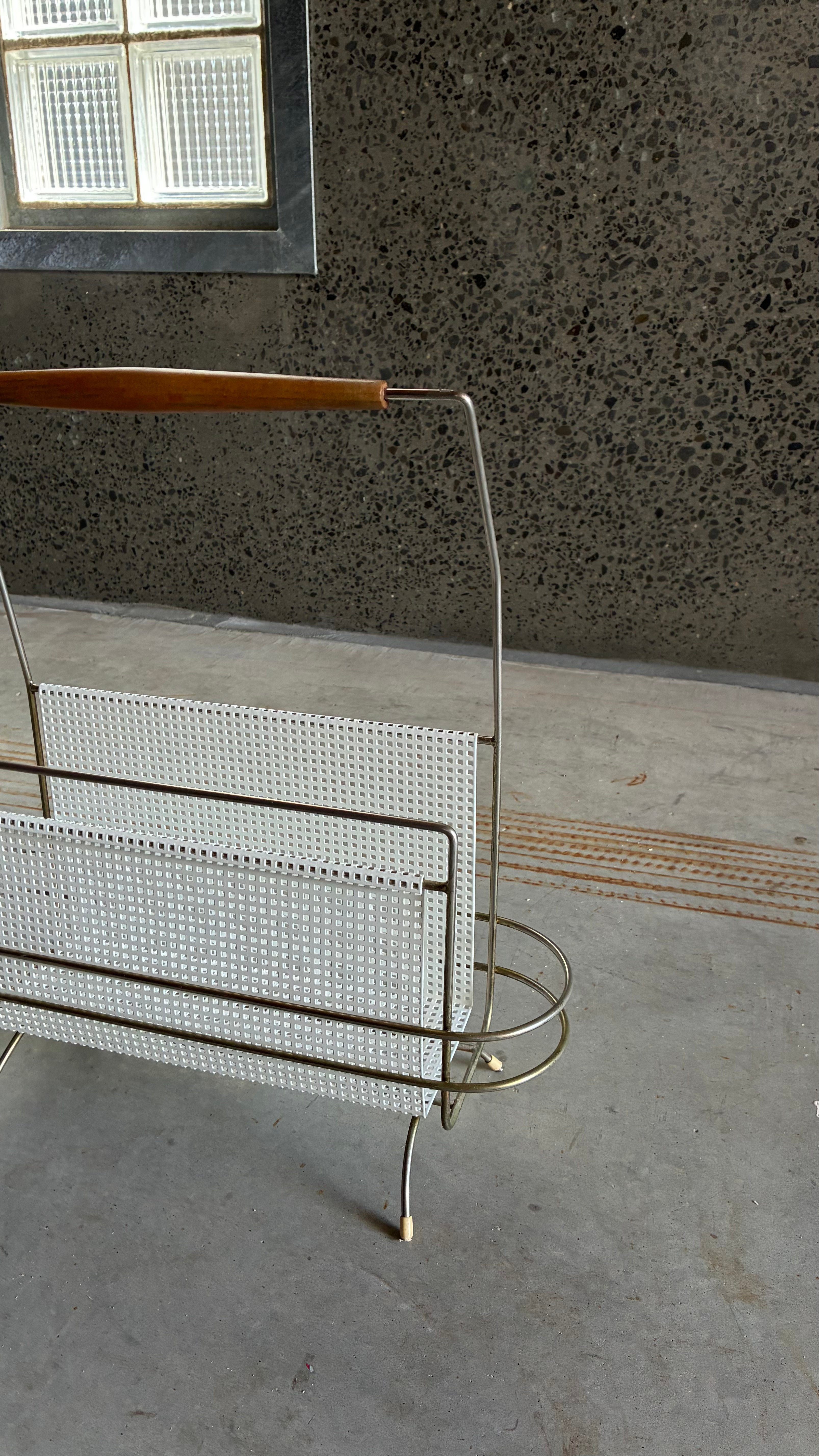 Mid-Century Magazine rack in the style of Mathieu Matégot