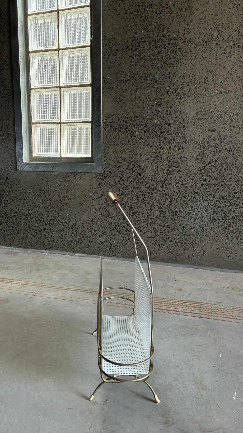 Mid-Century Magazine rack in the style of Mathieu Matégot