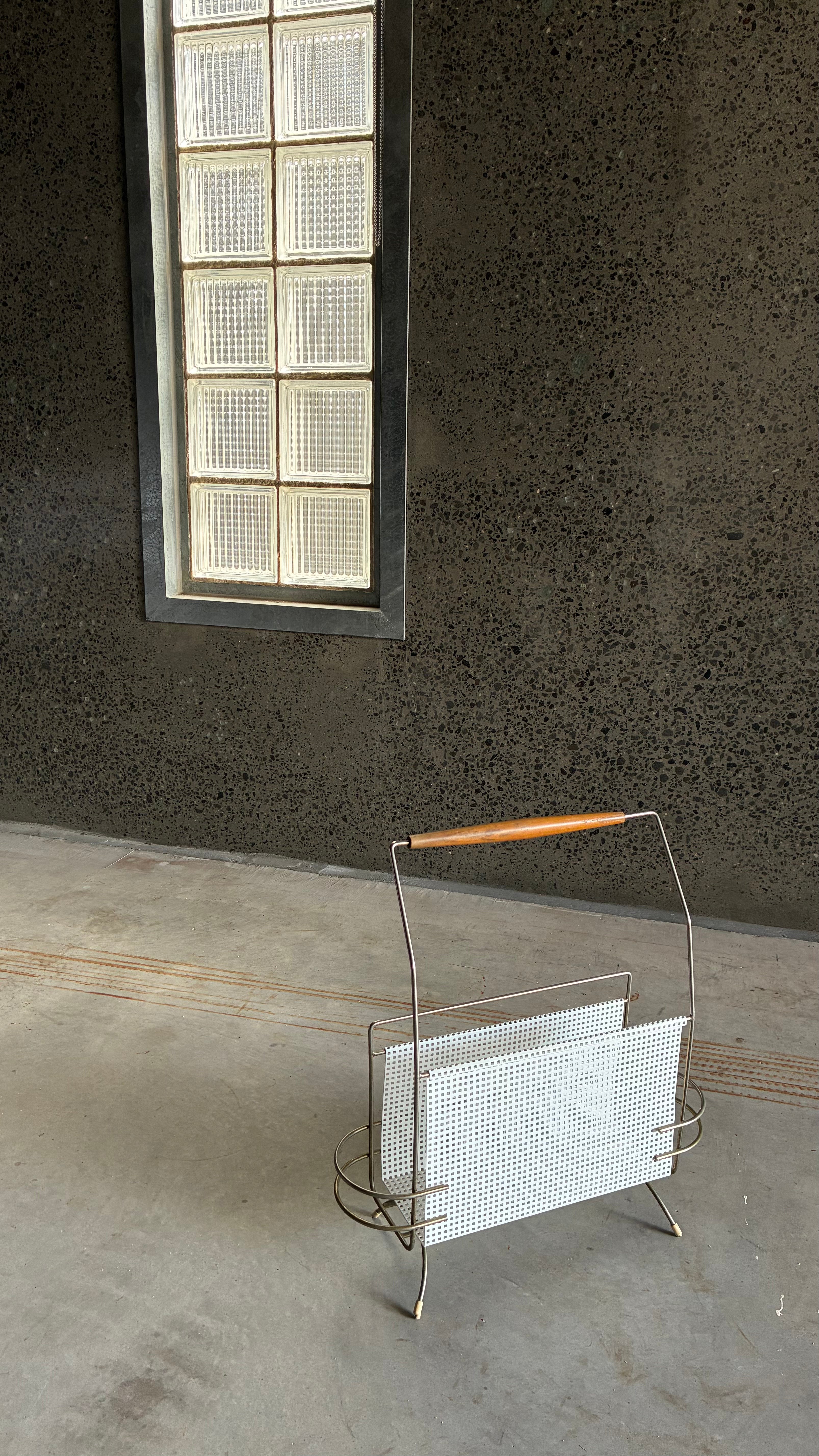 Mid-Century Magazine rack in the style of Mathieu Matégot