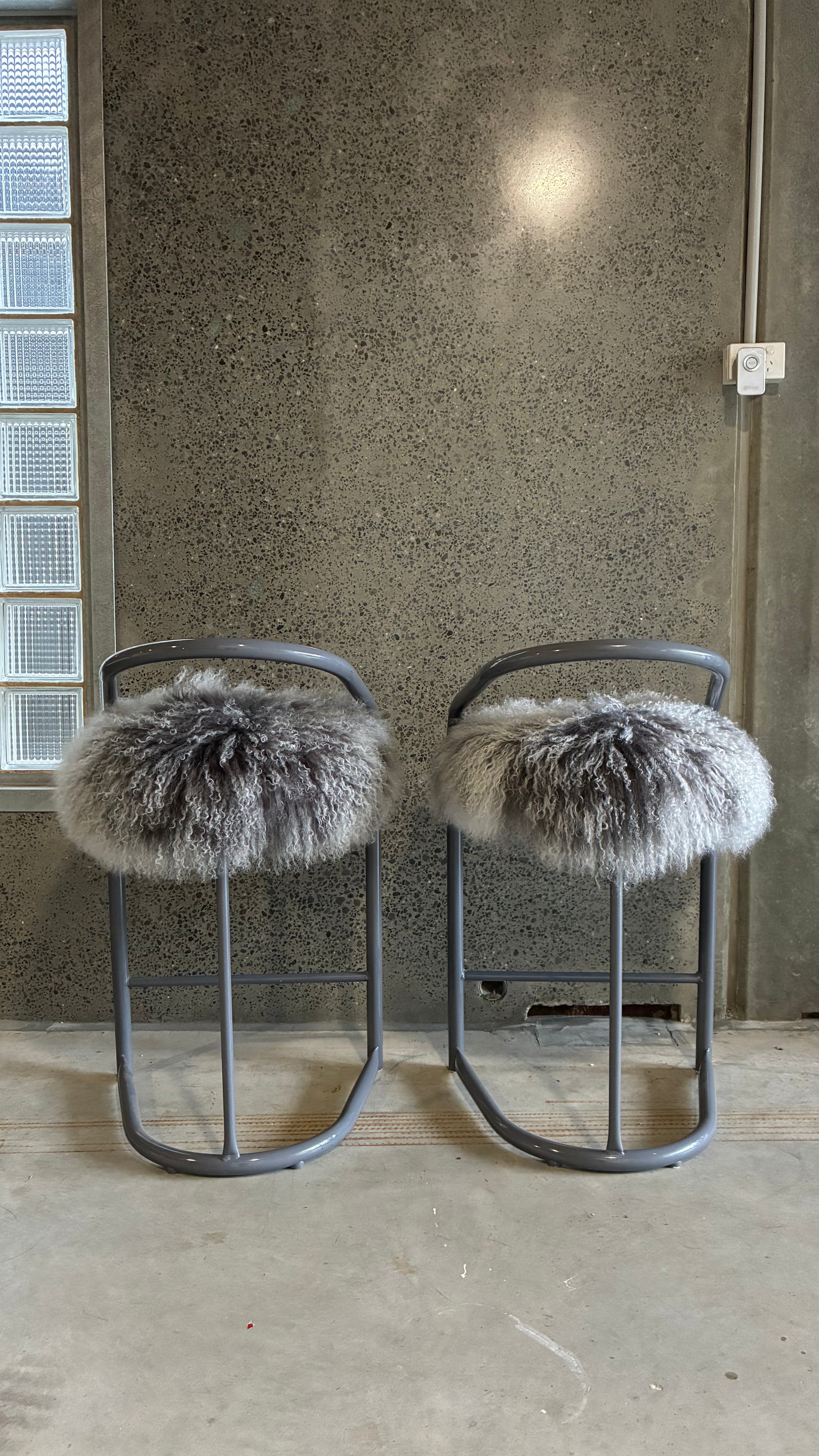 COUNTER STOOLS WITH MONGOLIAN UPHOLSTERY (PAIR)